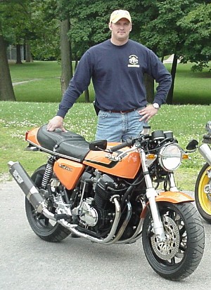 Tim Shutters standing next to his CB750F Super Sport